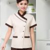 Đồng phục massage màu be viền nâu